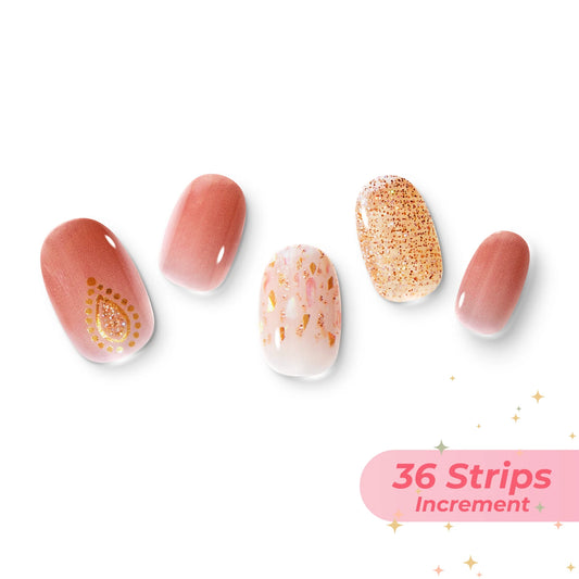 The gel nail wraps of ManiTini 'Prime Ruby Pomegranate' showcasing the ripened red pomegranate's allure weaves with a shimmering essence, sculpting a spellbinding beauty of matured fruit that enchants the senses.