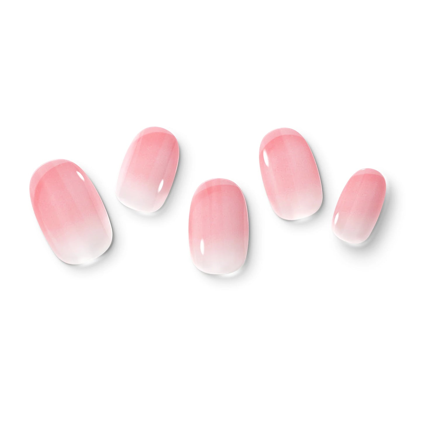 The gel nail wraps of ManiTini 'Blushing Petals' showcasing transparent gradients of nude pink gently cascading like blooming petals.