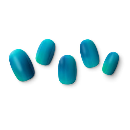 The gel nail wraps of ManiTini 'I Love Blue Fiji' showcasing the vibrant coral reefs of Fiji, where the azure sky blends with tranquil waters.
