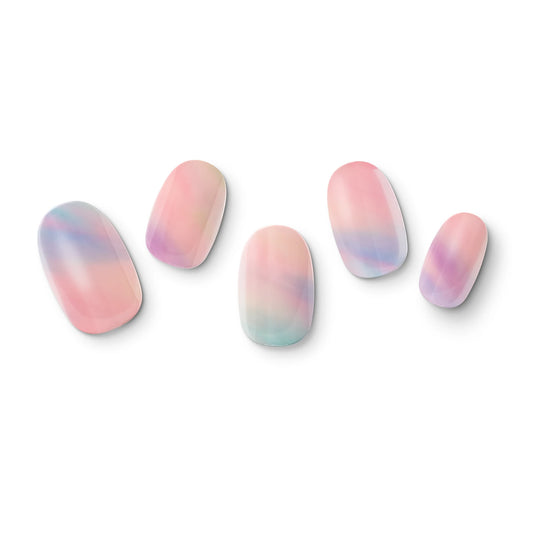 The gel nail wraps of ManiTini 'Whimsical Dream' showcasing the embrace of shades of dreamy bubbles with a fusion of magical and delightful pastels.