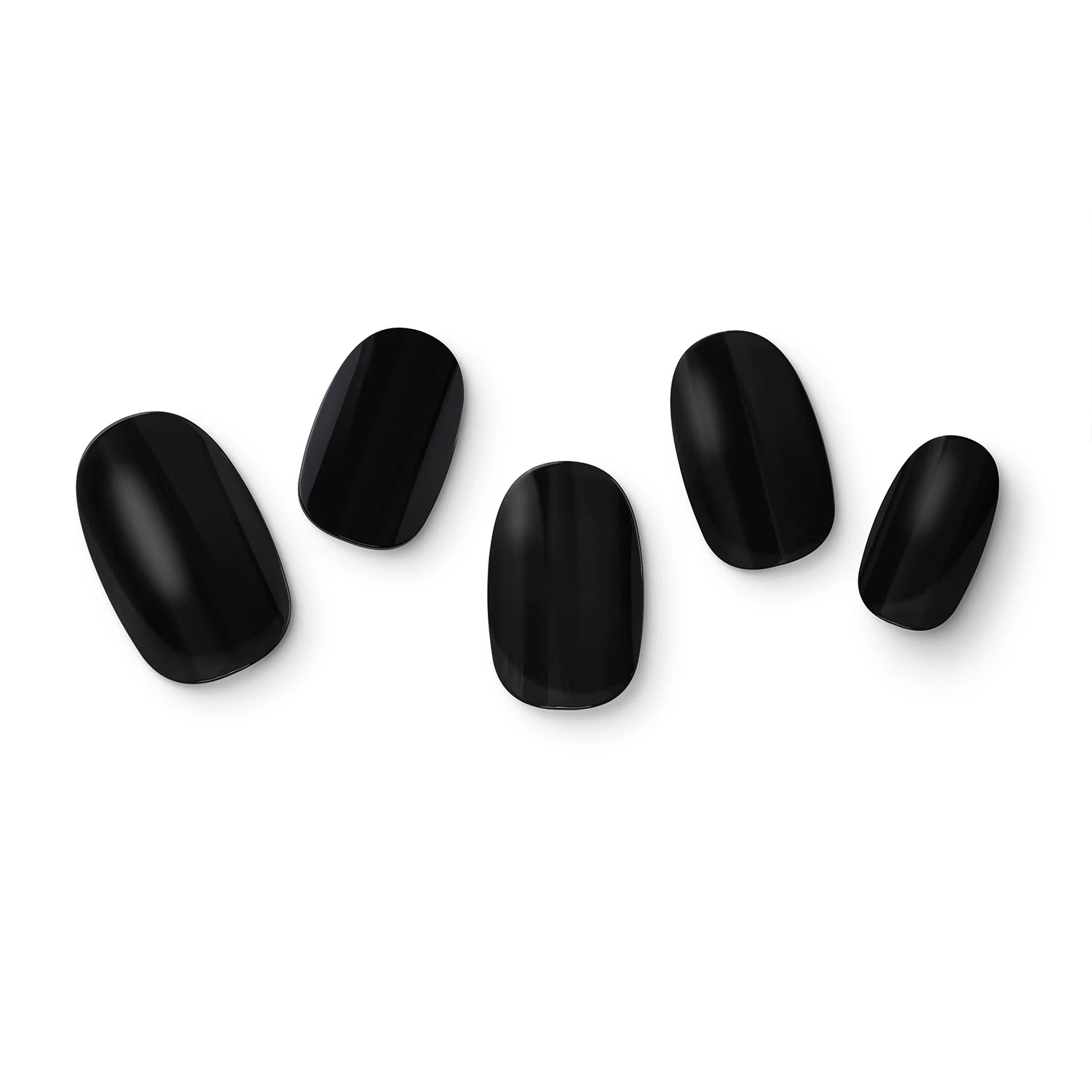 The gel nail wraps of ManiTini 'Sublime Noir' showcasing a mysterious shade of nocturnal black, making a bold statement of unique style.