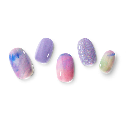 The gel nail wraps of ManiTini 'Mystical Unicorn' showcasing a captivating blend of pastel purples and pinks, evoking the enchanting spirit of a mystical unicorn.