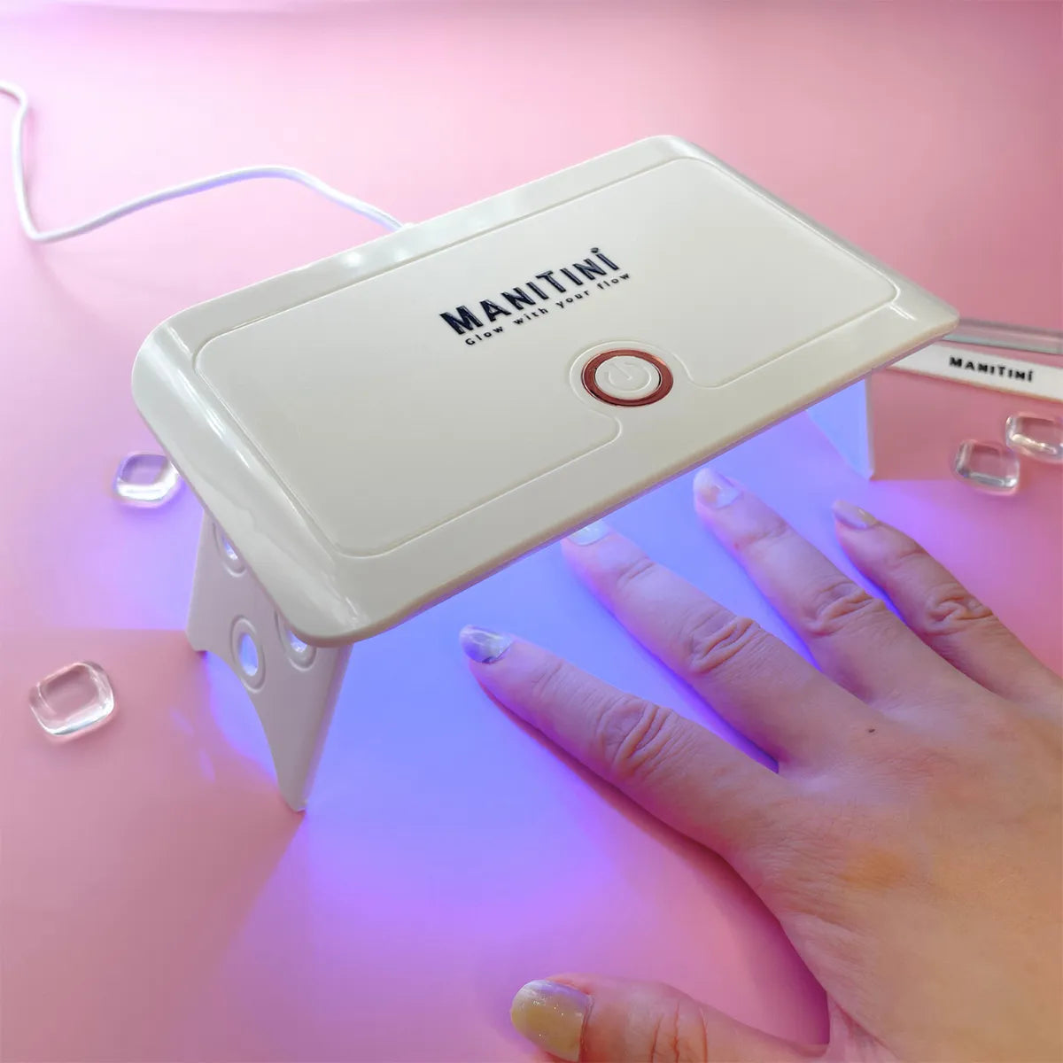 ManiTini Care+: Enjoy a professional nail salon experience in the comfort of your own home with the ManiTini compact and user-friendly UV LED lamp.